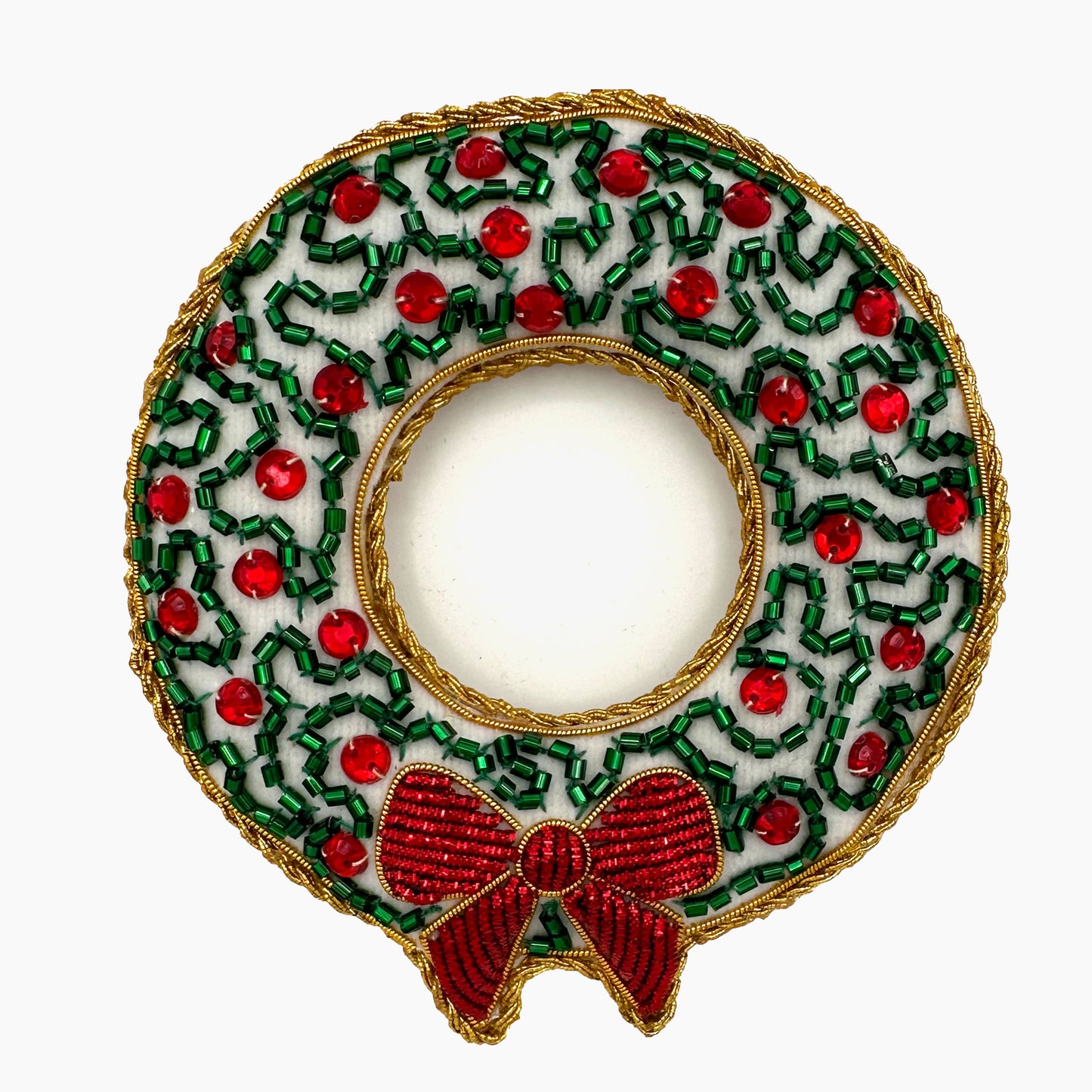 Image of a red berry and snowy wreath Christmas ornament with intricate beadwork.