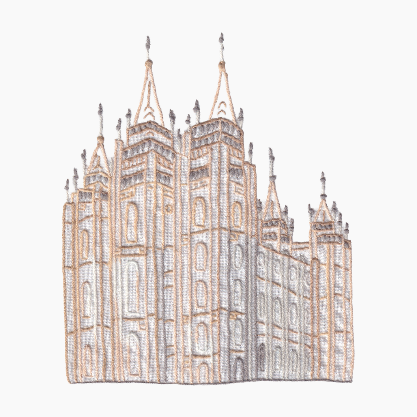Hand embroidered cotton towel of a large, detailed building Mormon cathedral or temple on a white background.