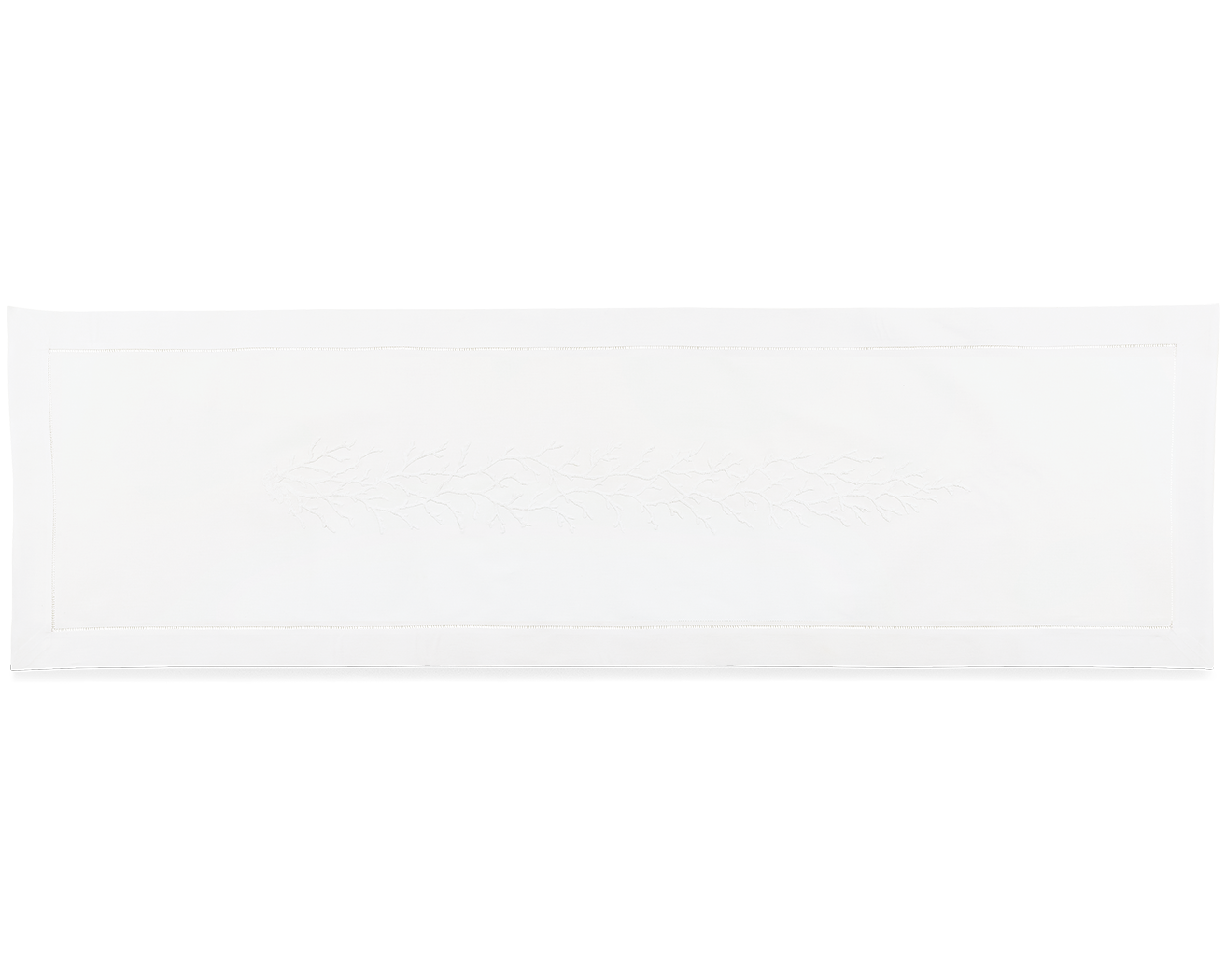 A white table runner. A white piece of coral is embroidered in a line down the middle.