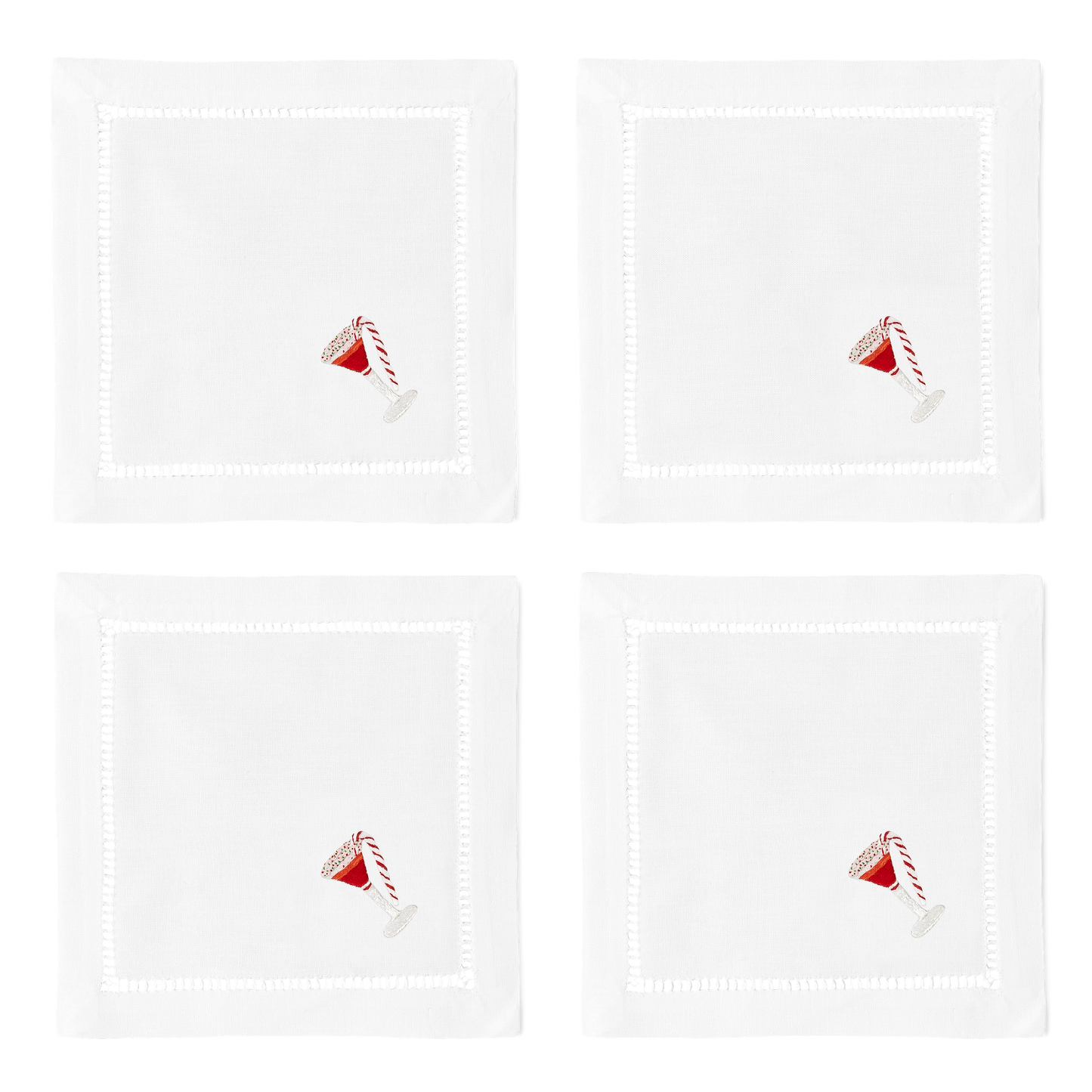 4 white cocktail napkins with a hemstitch border. A peppermint martini is embroidered on the bottom right corner of each