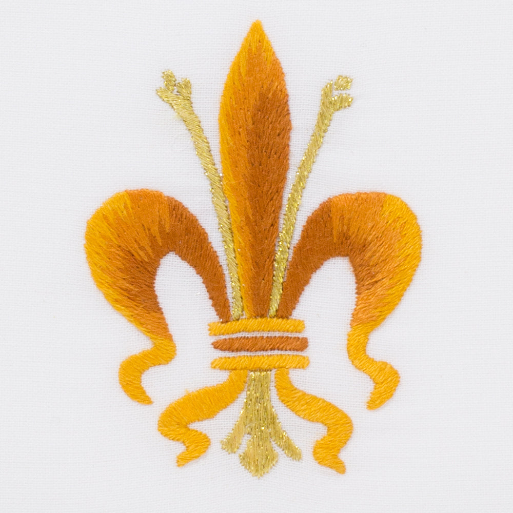 A detailed image of the embroidery - A yellow & gold fleur-de-lis symbol