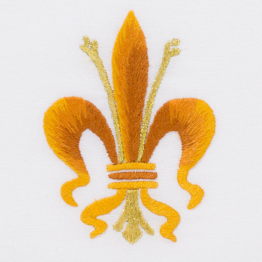A detailed image of the embroidery -  A yellow & gold fleur-de-lis symbol