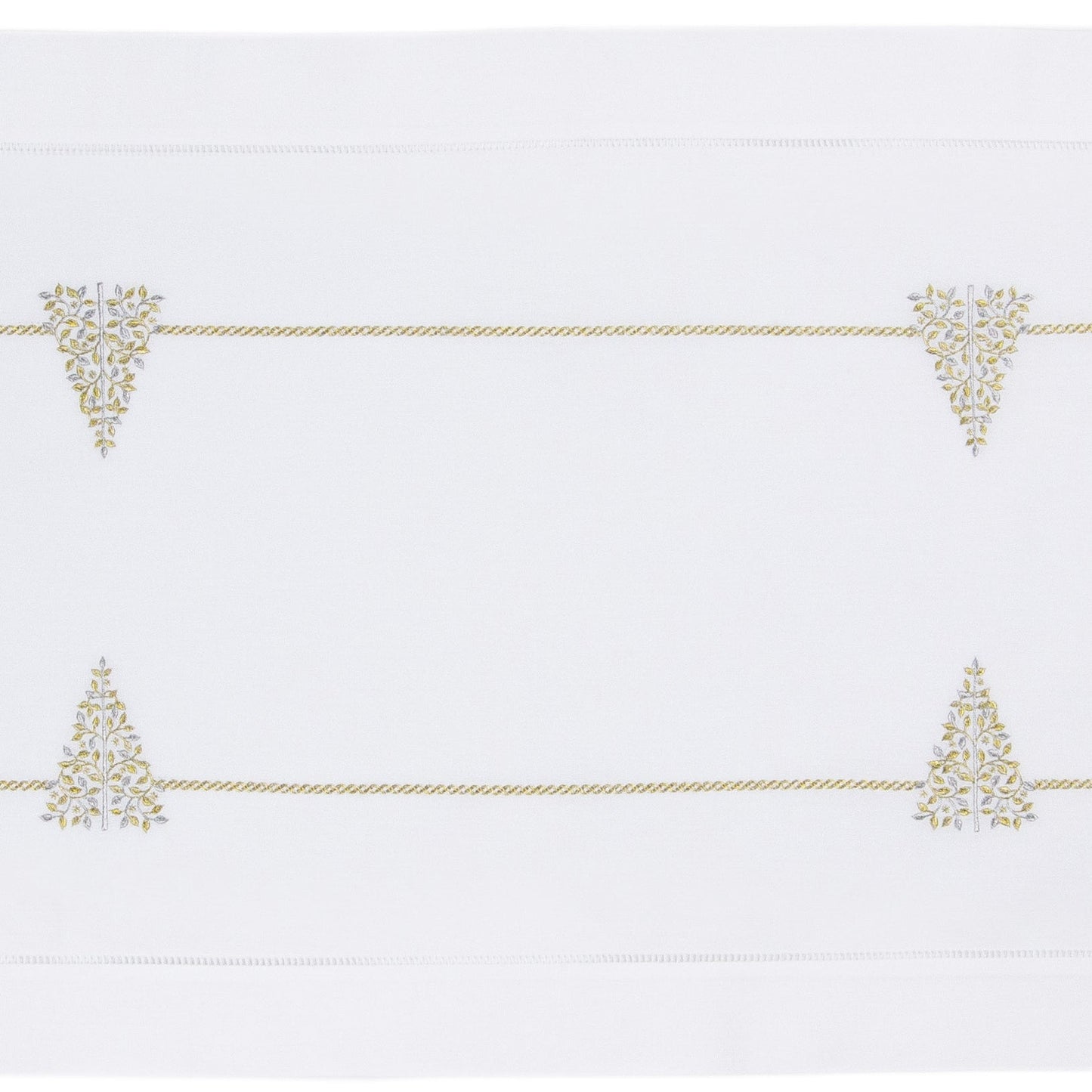 A white table runner with a hemstitch border. Glittering gold and silver christmas trees run down the middle