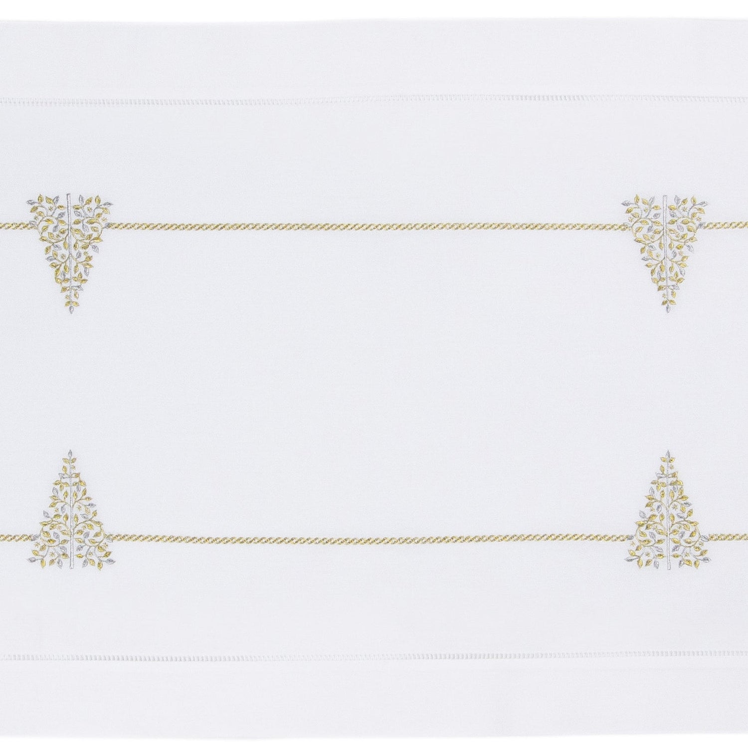 A white table runner with a hemstitch border. Glittering gold and silver christmas trees run down the middle