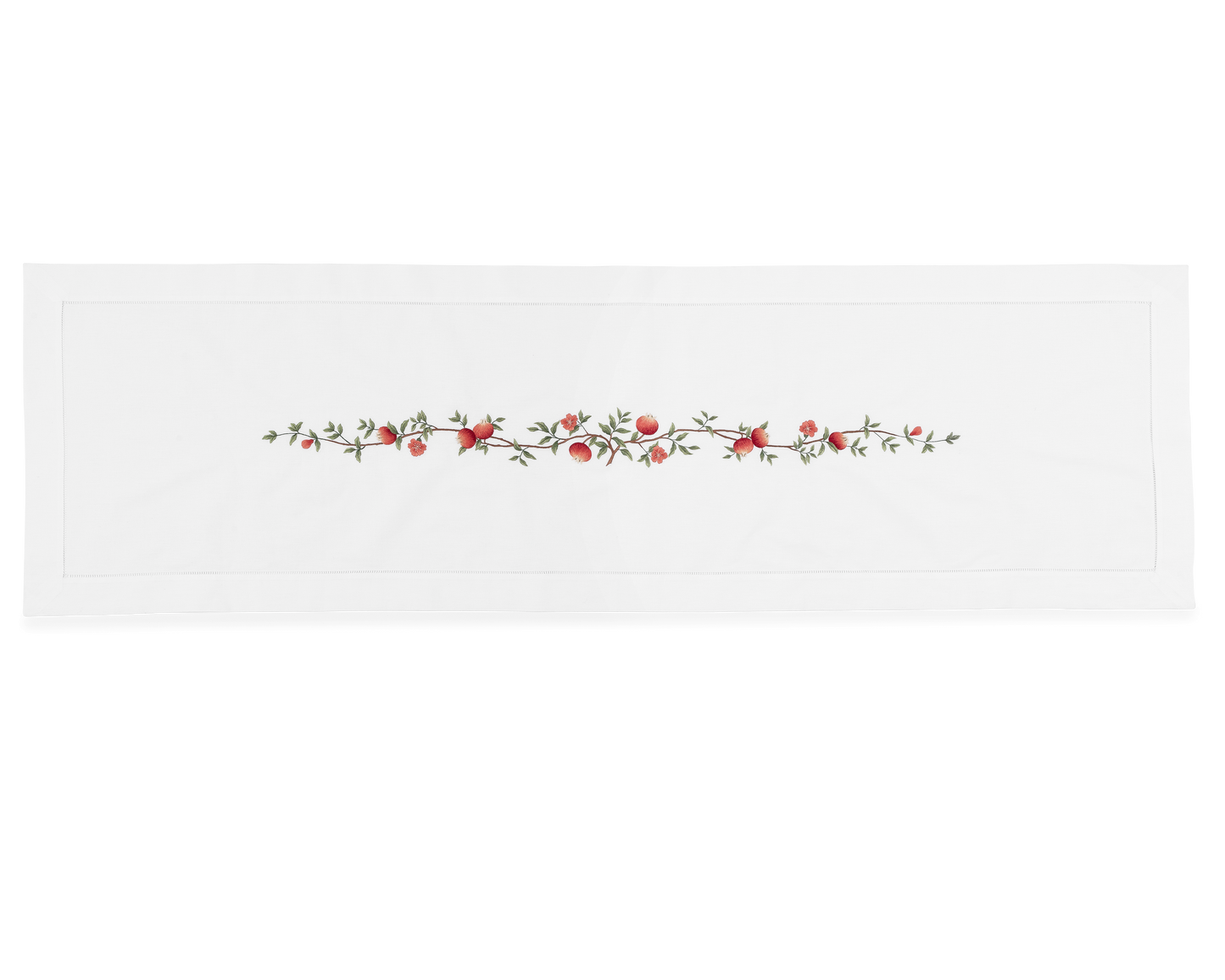 A white table runner with a hemstitch border. A branch of pomegranates extends down a line in the middle.