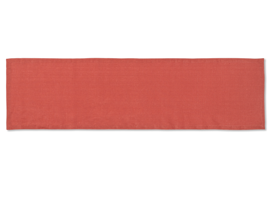A linen table runner in the color brick