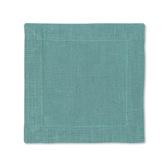 A square linen cocktail napkin in the color marine