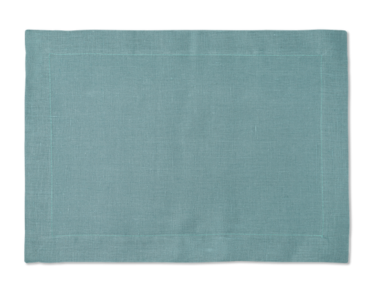 A linen placemat in the color marine