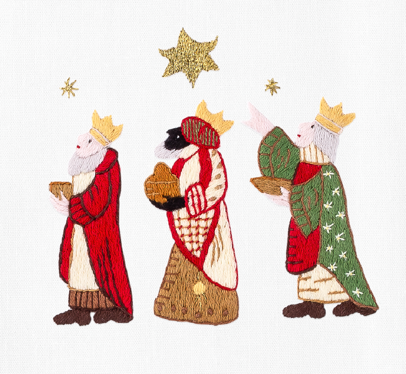 A detailed image of the embroidery - The 3 wise men carrying gifts & following a north star
