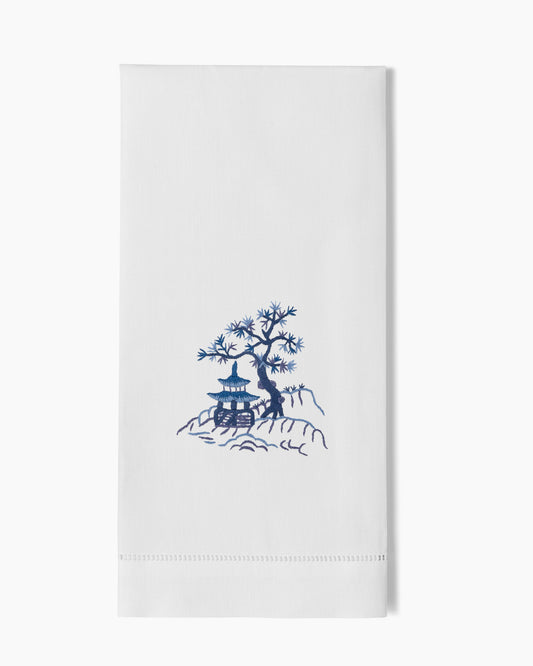 A Canton Blue Hand Towel with a blue tree on it, made by Henry Handwork.