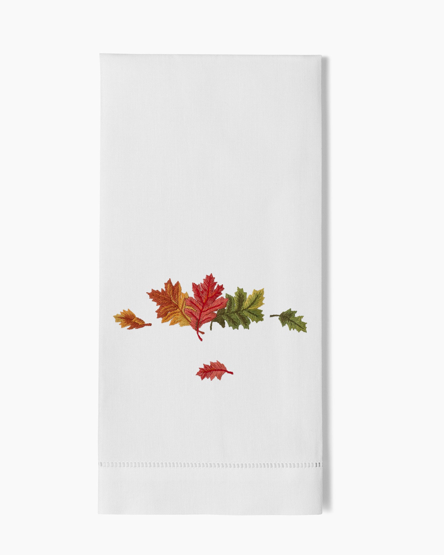 A white Fall Leaves Hand Towel with autumn leaves on it by Henry Handwork.