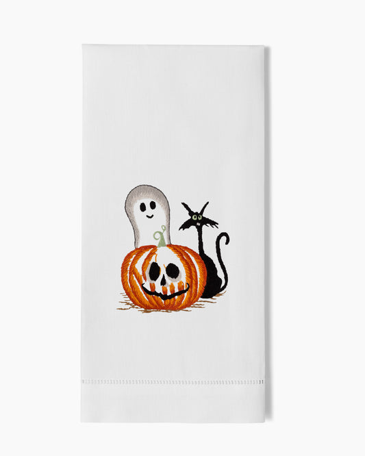 A white Halloween Friends Hand Towel with a black cat and a pumpkin by Henry Handwork.