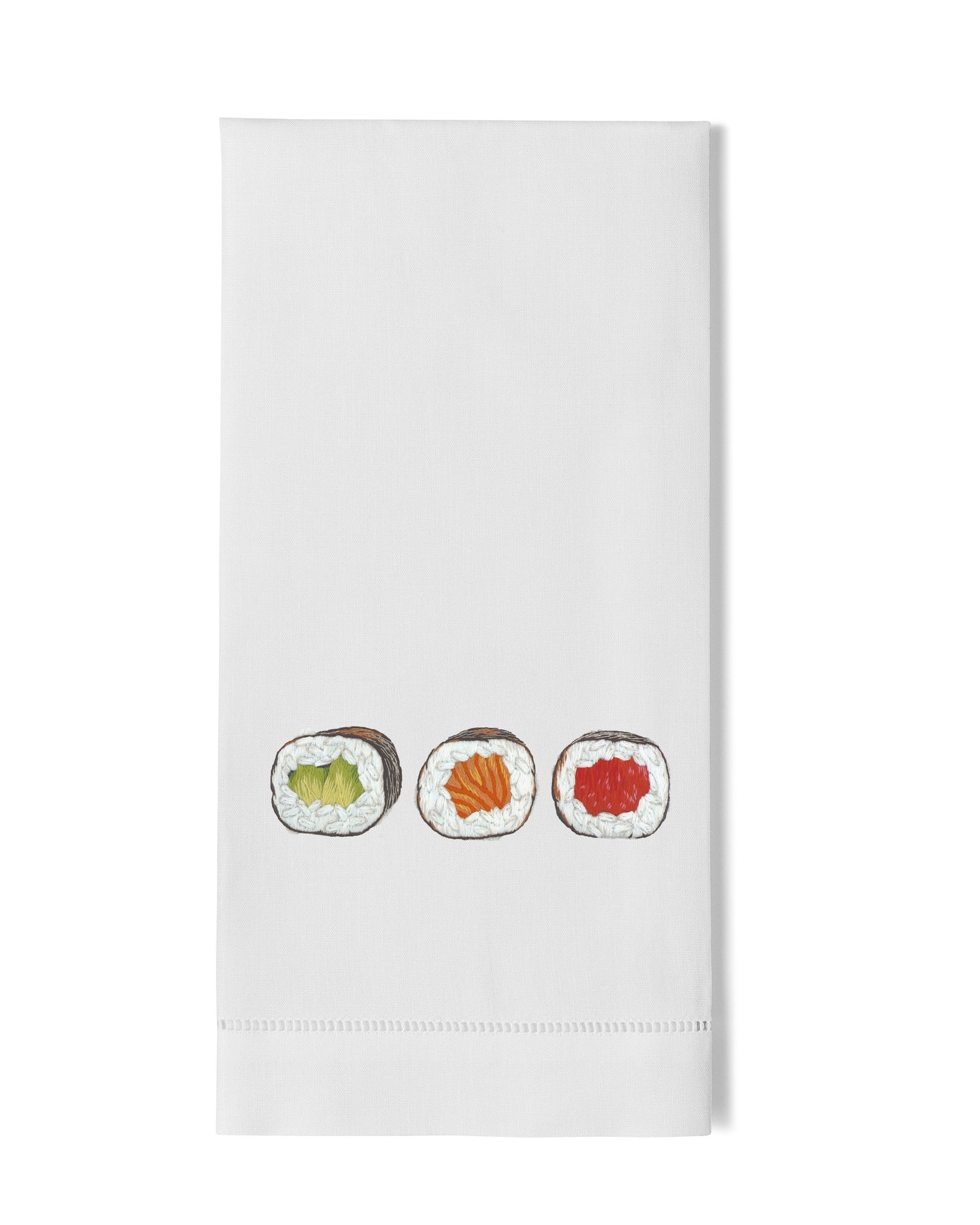 White towel with embroidered sushi design on a white background