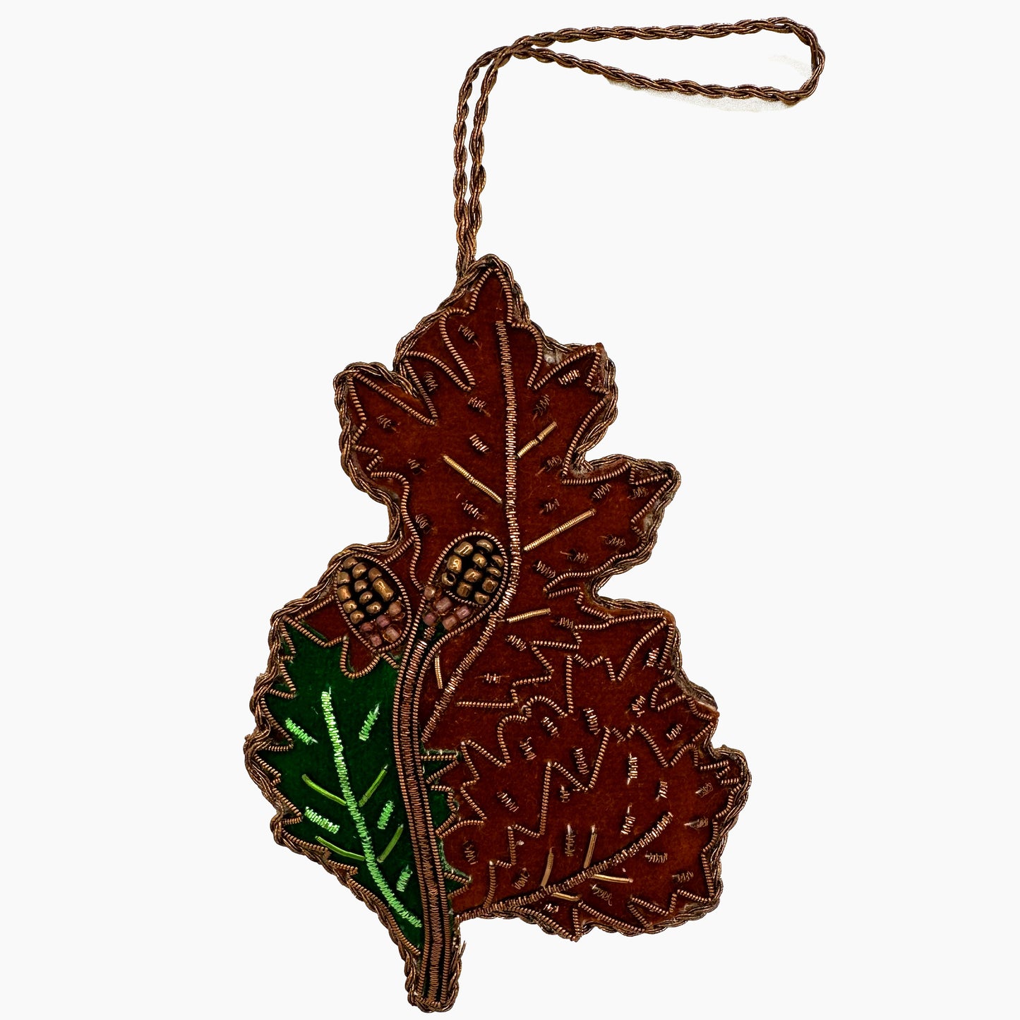 Image of an acorn leaf Christmas ornament with ornate beadwork.