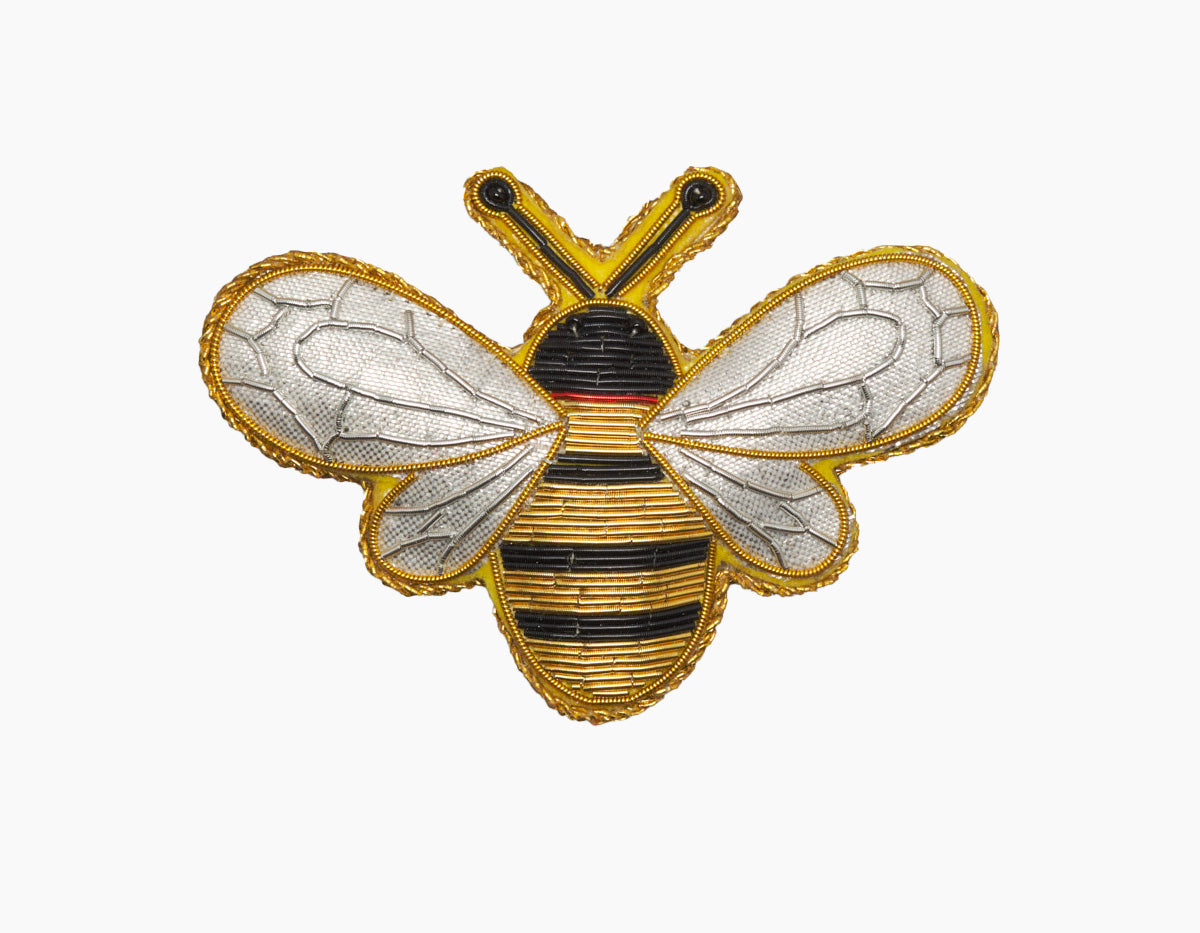 Image of a bumble bee Christmas ornament with intricate beadwork. 