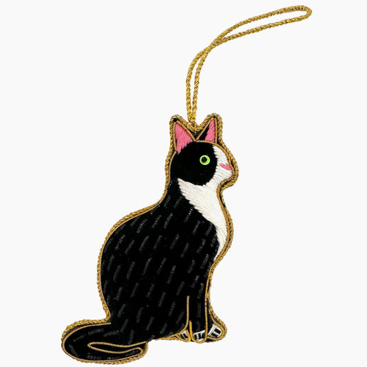 Image of a black and white house cat Christmas ornament with intricate beadwork.