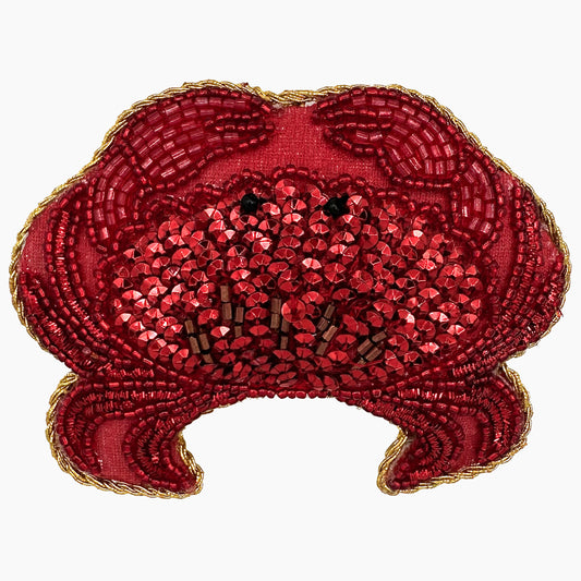 Image of a crab Christmas ornament with ornate beadwork.