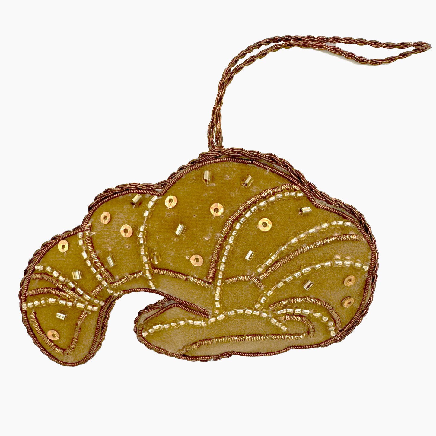 Image of a croissant Christmas ornament with intricate beadwork.