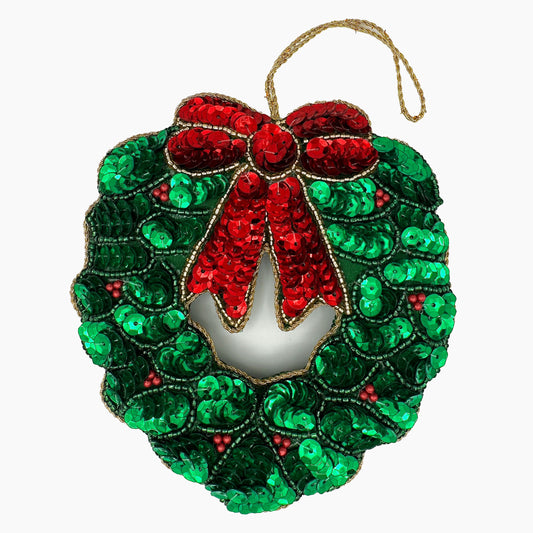 Image of a holly wreath Christmas ornament with intricate beadwork.