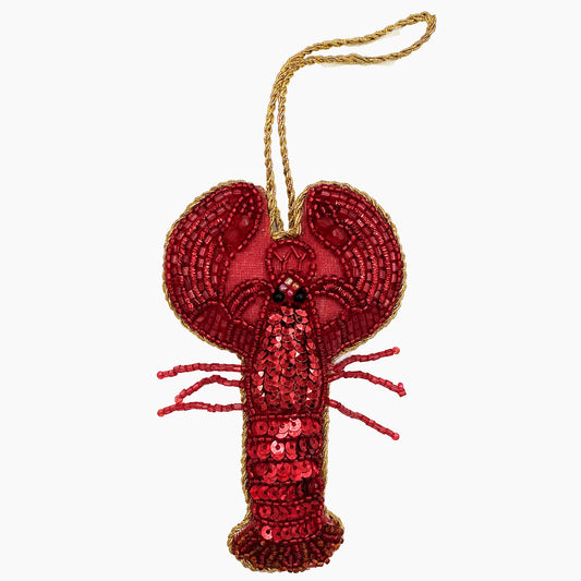 Image of a lobster Christmas ornament with intricate beadwork.