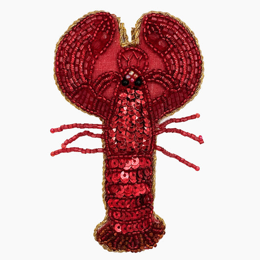 Image of a lobster Christmas ornament with intricate beadwork. 