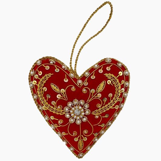 Image of a red heart Christmas ornament with ornate beadwork and pearls.