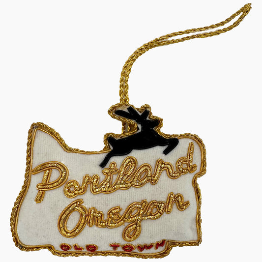 Image of a Portland Oregon Old Town sign Christmas ornament with ornate beadwork.