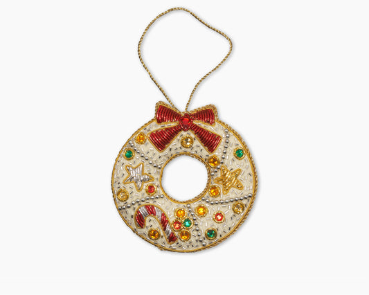 Image of a ribbon wreath Christmas ornament with intricate beadwork.