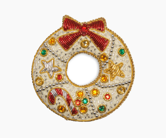Image of a ribbon wreath Christmas ornament with intricate beadwork. 