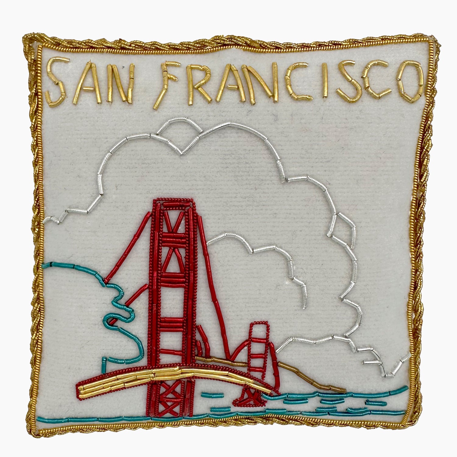 Image of the San Francisco Golden Gate Bridge Christmas ornament with intricate beadwork. 