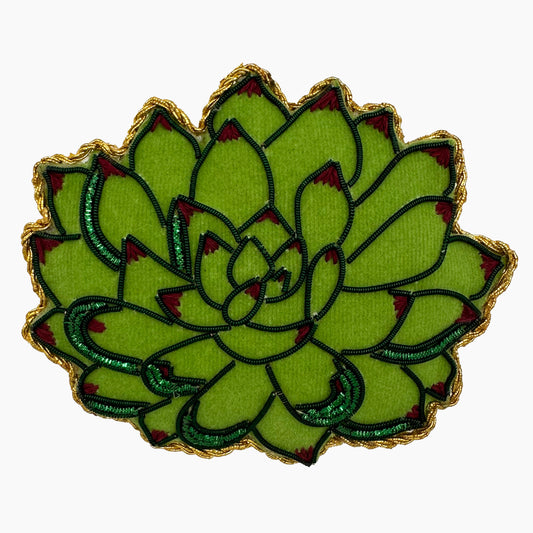 Image of a succulent Christmas ornament with intricate beadwork. 