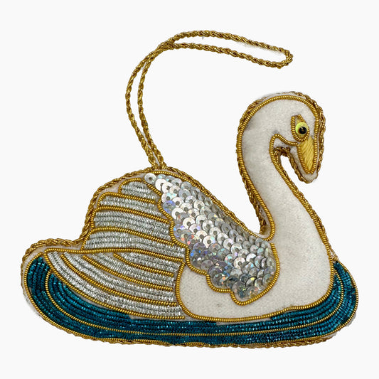 Image of a swan Christmas ornament with ornate beadwork.