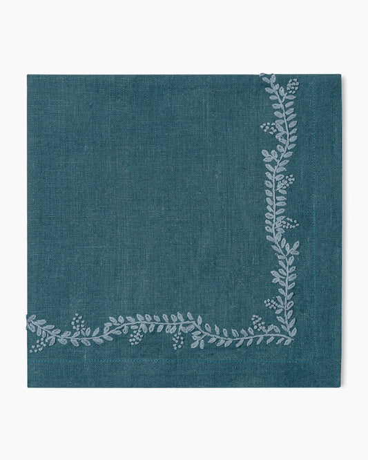 A Prism Vine Linen Dinner Napkin - 13 Colors with a floral pattern, perfect for enhancing your table linens collection.