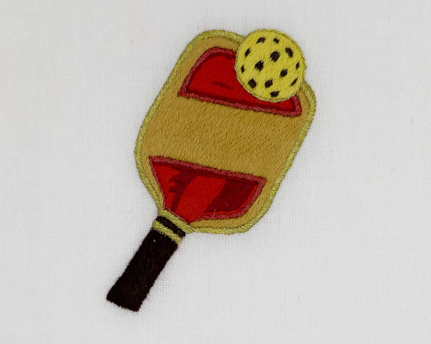 Image of a Henry Handwork Pickle Ball motif.