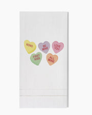 a white towel with hearts on it