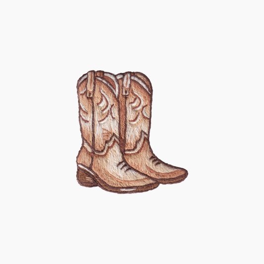Hand embroidered cotton boutique tissue box cover of cowboy boots on a white background