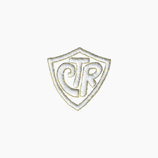 Hand embroidered cotton boutique tissue box cover of logo with 'CTR' inside a shield on a white background