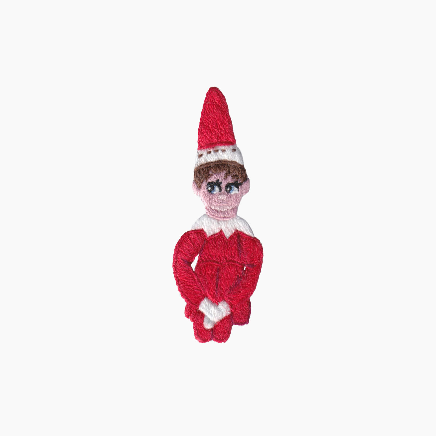 Hand embroidered cotton boutique tissue box cover of Elf on the Shelf toy wearing a red outfit and hat on a white background