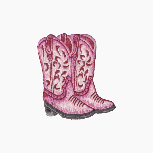 Hand embroidered cotton towel with pink cowgirl boots with intricate designs on a white background