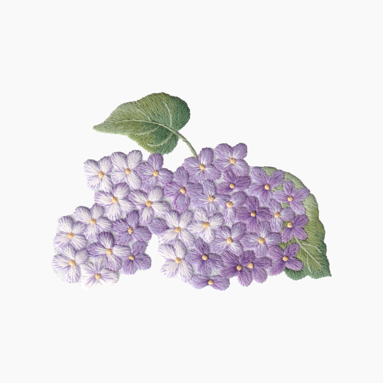 Hand embroidered cotton towel with  purple lilac flowers with green leaves on a white background