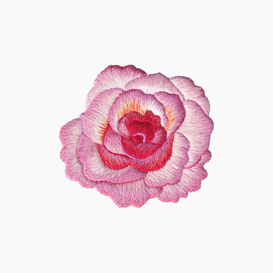 Hand embroidered cotton towel with  pink rose with red highlights on a white background