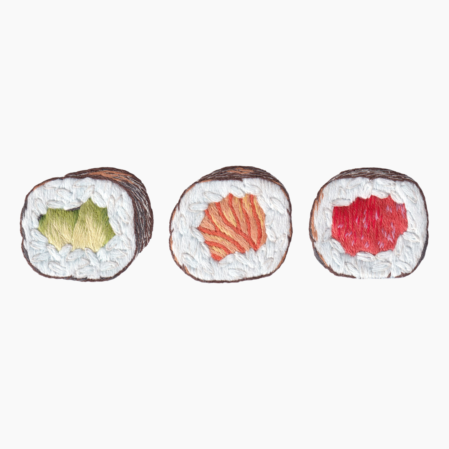 Hand embroidered cotton towel with three pieces of sushi with different fillings on a white background
