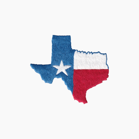 Hand embroidered cotton towel with the state of Texas with blue, white, and red colors on a white background