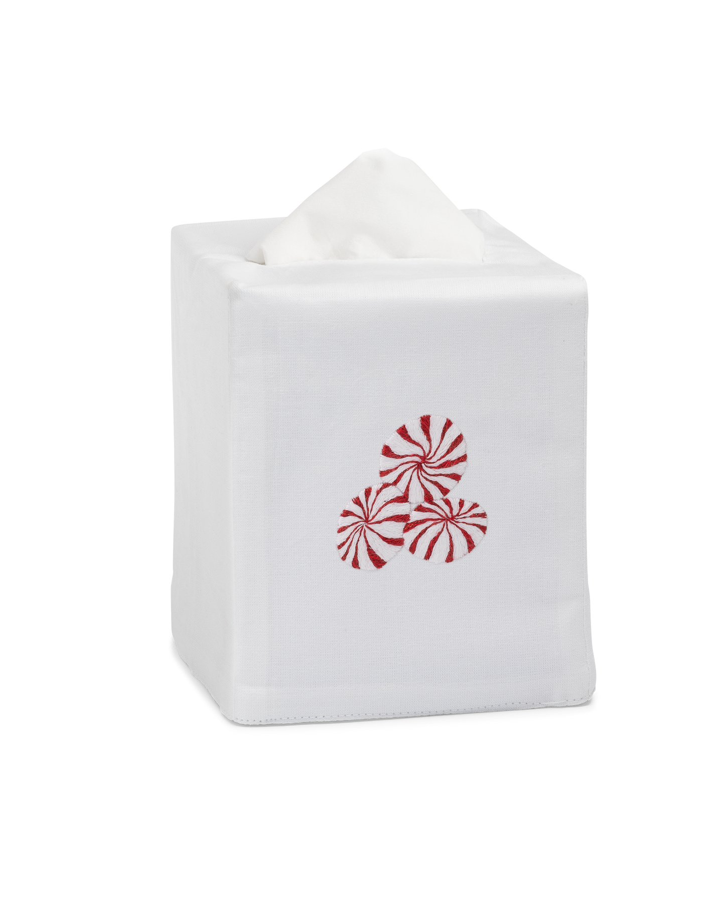 A white tissue cover with three peppermint candies embroidered in the center.
