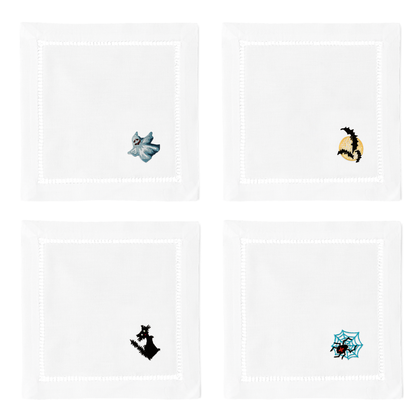 4 white cocktail napkins. Embroidered in the bottom right corner of each is a ghost, 3 bats, a black cat, and a spider. 