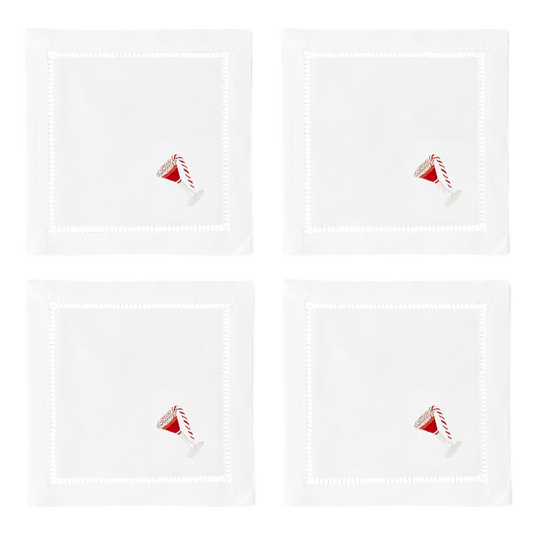 4 white cocktail napkins with a hemstitch border. A peppermint martini is embroidered on the bottom right corner of each