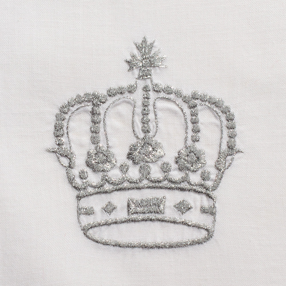 A close up detailed image of the embroidery - A silver crown.