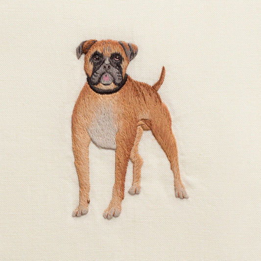 A close up detailed image of the embroidery - A brown boxer dog with a black collar