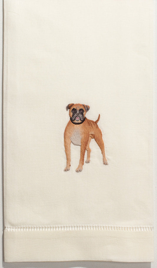 An ivory hand towel with a hemstitch. A boxer dog is embroidered in the center.