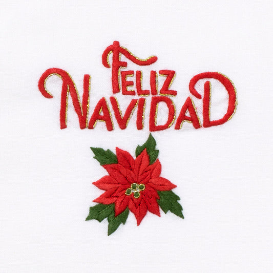 A close up detailed image of the embroidery - Red text saying “Feliz Navidad” above a poinsettia with green leaves